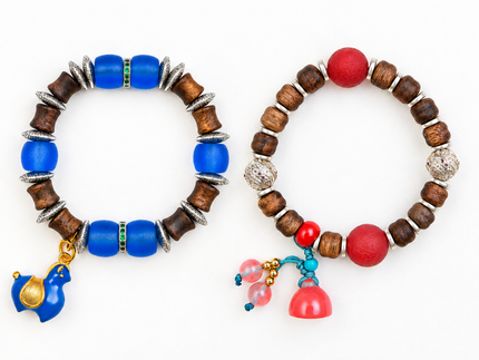 Two Patina Aura bracelets with blue and red accents displayed side by side