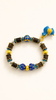 Open Possibility naturally aromatic agarwood bracelet with blue cloisonne details and a playful horse charm