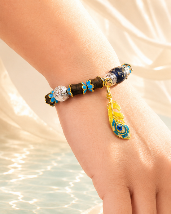 Deep Current agarwood bracelet worn on wrist beside water