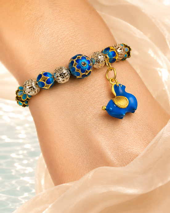 Mystic Clarity bracelet worn on wrist beside water